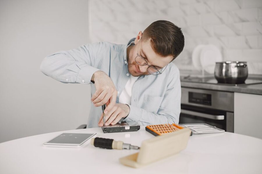 Technician repairing a home appliance