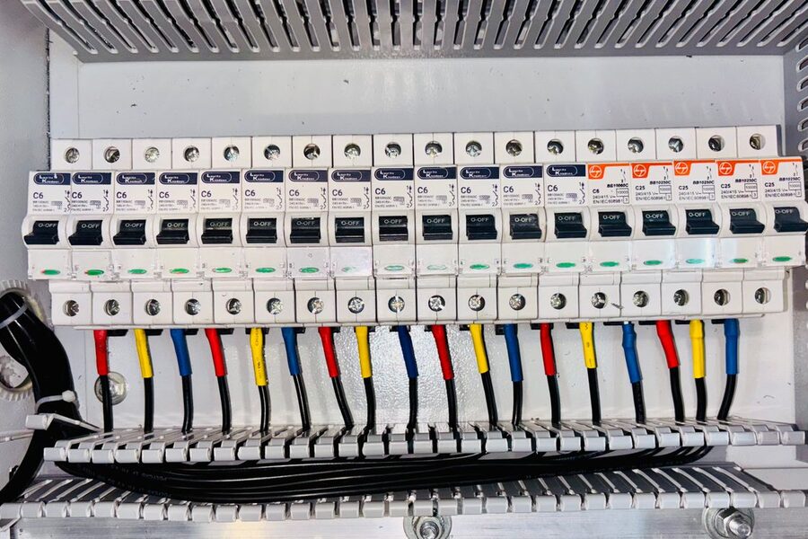 Electrician working on a breaker panel